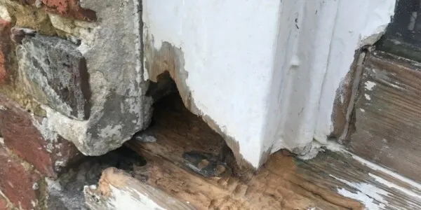2 chipped corner of wooden frame