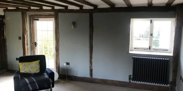 small room with blue painted walls